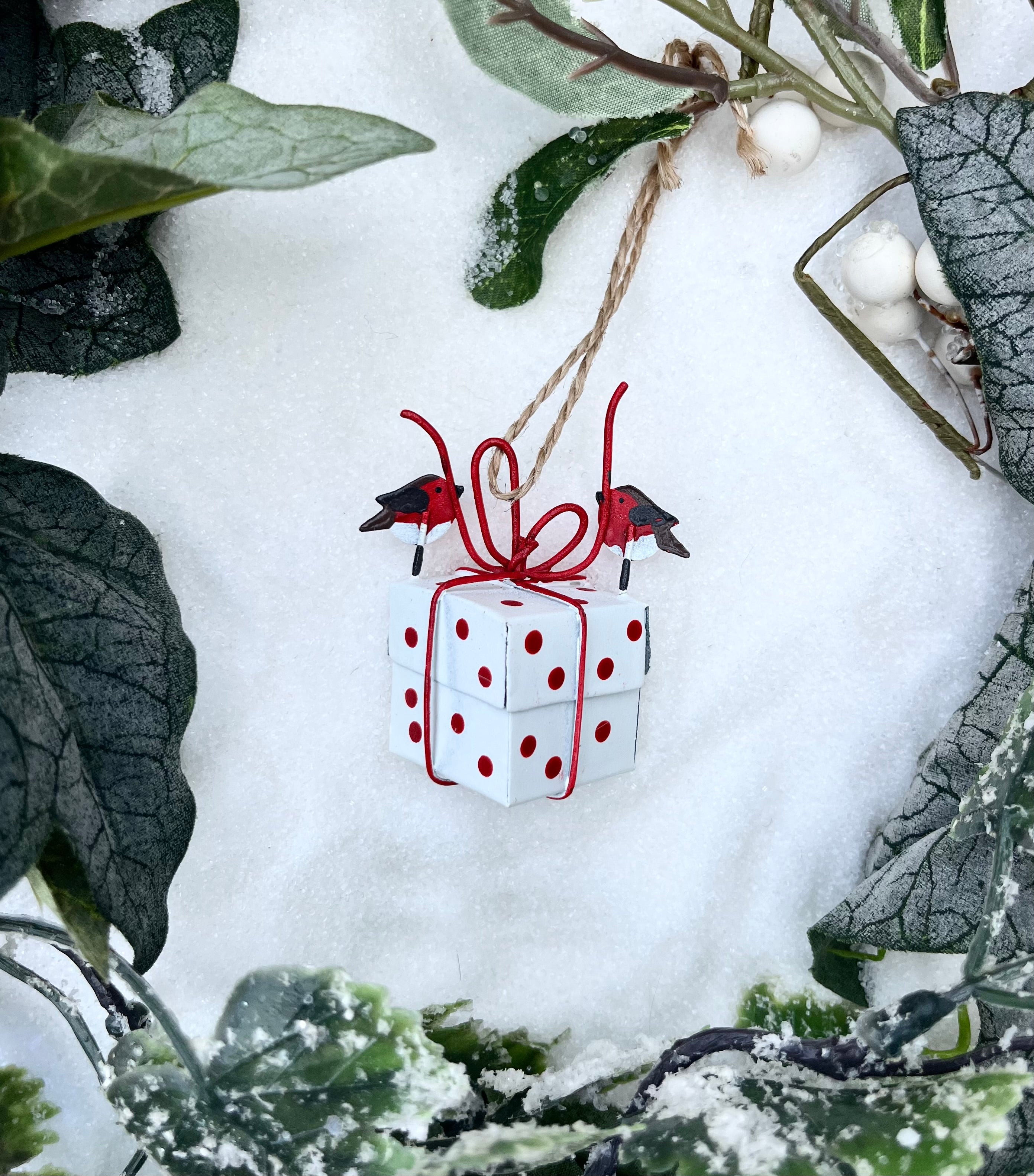 Robins Tying a White Xmas Present